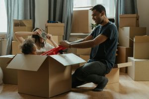 A family playing in a box.