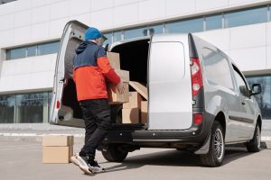a mover packing up a van after talking about the common misconceptions about moving brokers