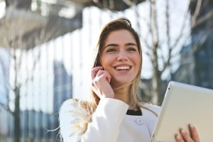 Person smiling while talking on the phone about What to Know Before Hiring a Moving Company in Pennsylvania