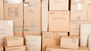 Moving boxes with hand-written labels.